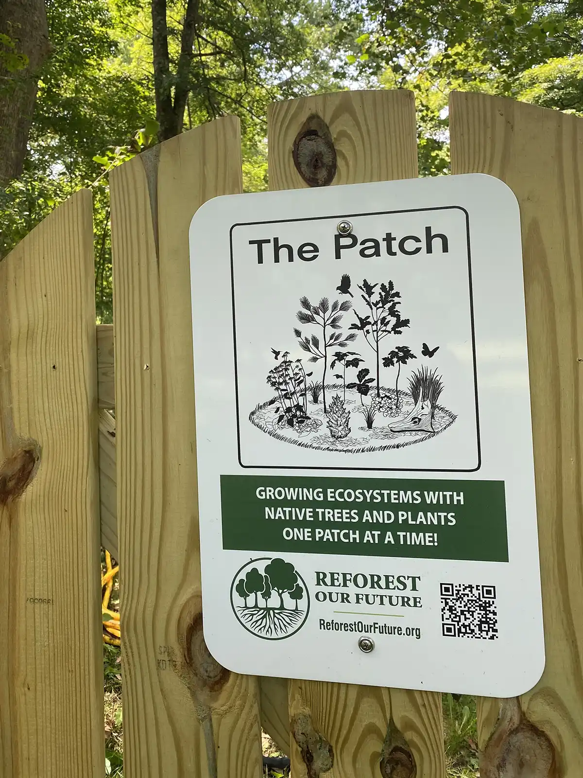 The Patch sign on wooden fence